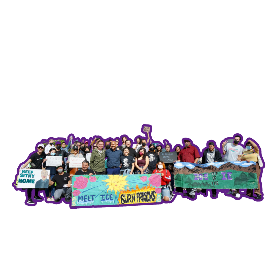 Group photo holding signs and banners